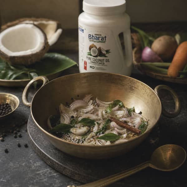 Curry leaves bloom in Bharat coconut oil for stew