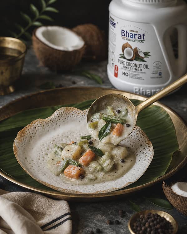 Appam served with coconut stew and Bharat coconut oil